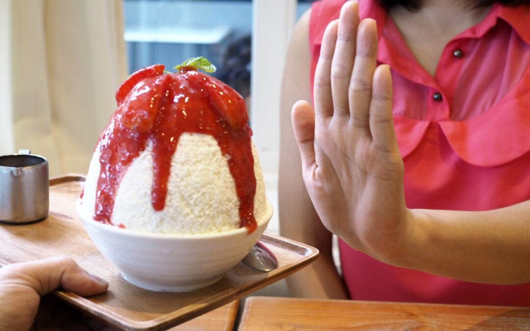 woman refusing to eat ice cream